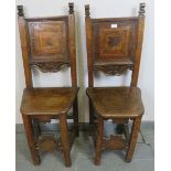 A pair of 17th century and later cherrywood Tyrolean his and hers inlaid hall chairs, the back