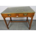 A vintage yew wood brass bound campaign style desk, with inset green leather gilt tooled writing