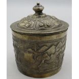 A white metal round lidded Indian box. Embossed with trees, houses and temples. 4.6 troy oz/142