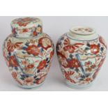 Two Japanese Imari jars, hand decorated, one missing cover. Height 19cm. (2). Condition report: No