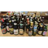 A collection of vintage British and World beers 1970s-1990s, including many in 1 pint bottles.