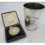A Felsted school steeple chase silver medallion. Birmingham 1918. 36 grams. Boxed. Also a plated