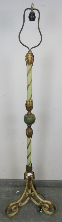 An ornate metal standard lamp in the Florentine taste, with painted rope twist column and gilt