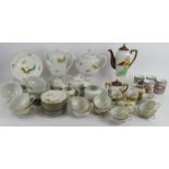 A large Japanese eggshell porcelain tea and coffee set with Geisha Lithophane cups and another