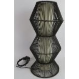 A modernist twin waisted Canework lamp with Ecru canvas shade. Height: 55cm. Condition report: No