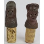 Two continental stoneware figural bottle tops depicting women in period head wear. (2). Condition