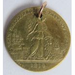 A brass commemorative medallion jeton, 1814 Peace of Paris, designed by William Kettle. Gilt brass