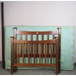 An Edwardian mahogany small double bed with square finials, featuring walnut inlay and strung with