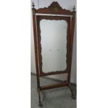 A fine 19th century French parquetry inlaid cheval mirror, with ormolu mounts and finials, on