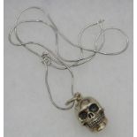 A Thomas Sabo 925 stamped skull pendant on a 925 snake chain. Approx weight 12 grams, boxed.