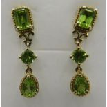 Peridot post back drop earrings, pear round & emerald cut stones of good cut and colour. Gold plated