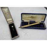 A single pearl 10ct yellow gold stick pin, pearl 8mm across, boxed and a gold filled Wahl pen,