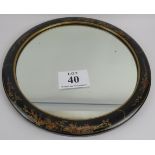 20th century chinoiserie mirror, the circular oriental design on black ground. 53cm circumference.