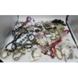 A large collection of mainly costume jewellery to include a child's silver bracelet.