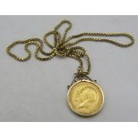 An Edwardian mounted sovereign 1911 on a 9ct gold box chain. Approx weight 17.5 grams. Condition