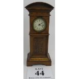 Miniature long case clock, walnut, traces of gilding to etched panel, not tested, 18cm height.