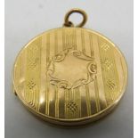 A 15ct yellow gold circular locket, Approx 28mm across, approx weight 7.3 grams. Condition report: