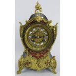 A French ormolu mounted boulle inlaid and ebonised mantel clock in the Louis XVI style, early 20th