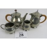 Liberty and Co, English pewter 4 piece tea set, 1372. Hammered surface. Raffia handle to tea pot.