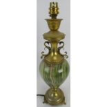 A table lamp with a polished marble baluster shaped form, dragon style mounts on an associated