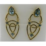 Rantanakiri blue zircon gemstone earrings, 32mm length, post back. Bevel set & prong set round
