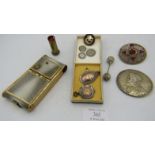 An assortment of items to include two fully hallmarked silver medallions, a brooch 'Cornwall', two