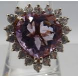 An amethyst cocktail ring, size S. Large 23mm x 20mm portrait setting. Gold plated on 925. Good cut,