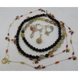 An agate & yellow stone necklace, a black agate & onyx necklace and a long ruby, citrine, agate &