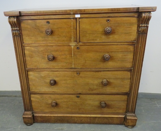 A Victorian mahogany chest of two short over three long graduated cock-beaded drawers with