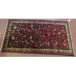 North West Persian Malayer rug, central panel of red ground with flower and bird design, beige