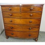 A Georgian mahogany bow-fronted chest of two short over four long graduated cock-beaded drawers with