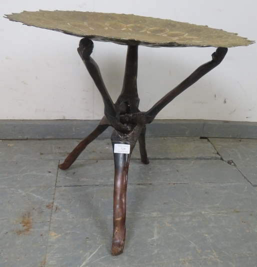 An antique North African folding tray table, the dished brass top featuring intricately hand-