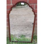 An Edwardian wall mirror in a shaped mahogany surround. H71cm W41cm (approx). Condition report: No