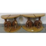 Four vintage teak nesting tables with carved bases in the form of elephants. H33cm W22cm D23cm (