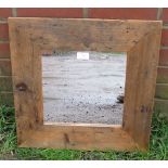 A square wall mirror in an antique pine surround. H49 W49 (approx). Condition report: No issues.