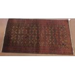 North East Persian meshed Belouch rug, central panels of reds and blues. 183cm x 100cm. Condition