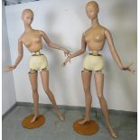 A pair of vintage Art Deco Period Parisian shop display mannequins, with posable joints, on circular
