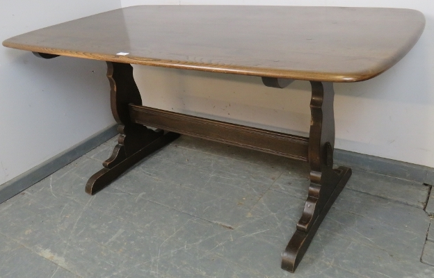 A mid-century elm refectory dining table by Ercol, on shaped supports with a middle stretcher. H72cm - Image 2 of 5