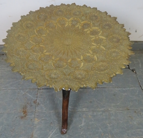 An antique North African folding tray table, the dished brass top featuring intricately hand- - Image 2 of 2