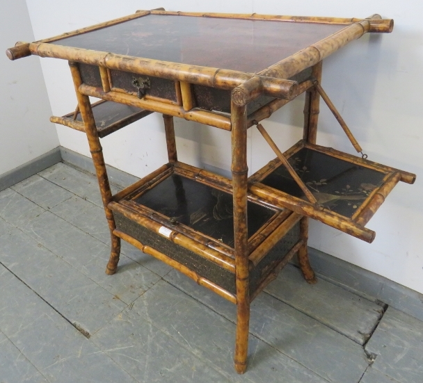 A 19th century colonial bamboo two-tier occasional table, featuring black lacquer panels hand - Image 2 of 4