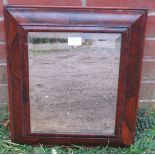 A late 17th/early 18th century walnut oyster veneered cushion mirror with bevelled plate. H46cm