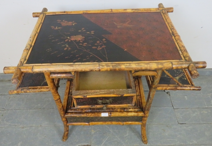 A 19th century colonial bamboo two-tier occasional table, featuring black lacquer panels hand - Image 3 of 4