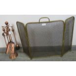 An Edwardian copper and brass fireside companion set, together with a three-section brass and wire