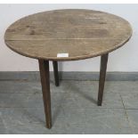 An 18th century and later oak cricket table, on tapering square supports (a/f). H57cm Diameter