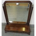 A good quality Regency Period mahogany swing vanity mirror, with shaped and bevelled glass,