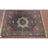Persian rug japer central motif padsso foliage in blues and reds. 180cm x 130cm. Condition report:
