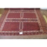 A 20th century (Afghan Hatchli) carpet, repeat pattern on terracotta field. Condition good. 260 cm x