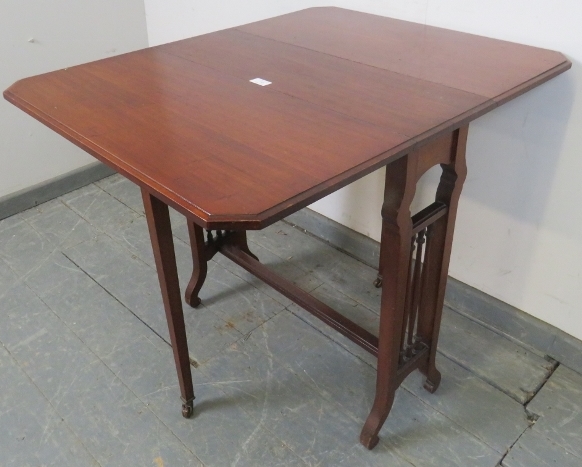 An Edwardian mahogany Sutherland table, with turned spindles to either side, on scrolled supports. - Image 3 of 4