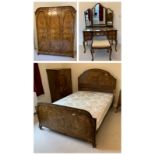 A 1920s burr walnut bedroom suite comprising a double bed, triple wardrobe, compactum, bedside