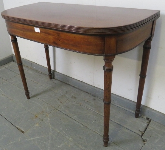 A George III mahogany turnover card table, with reeded edge, on tapering turned supports. H71cm - Image 2 of 5